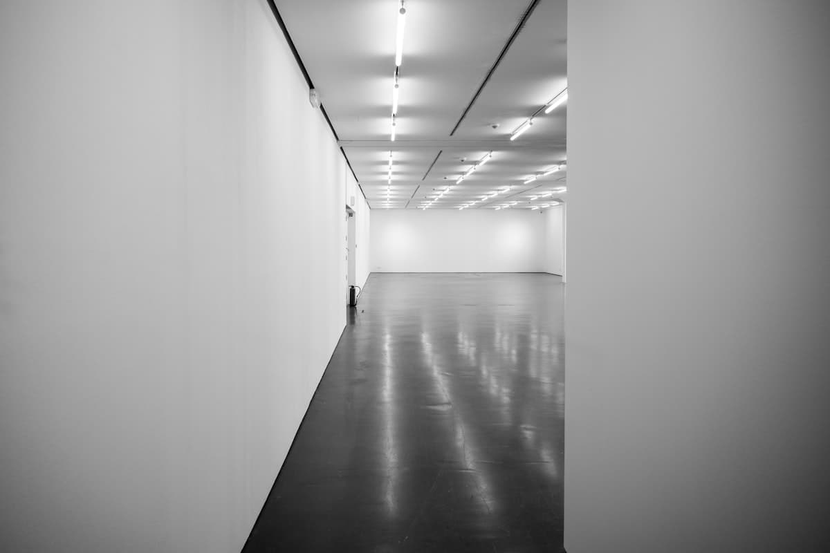 Bright retail gallery with seamless reflective epoxy floor
