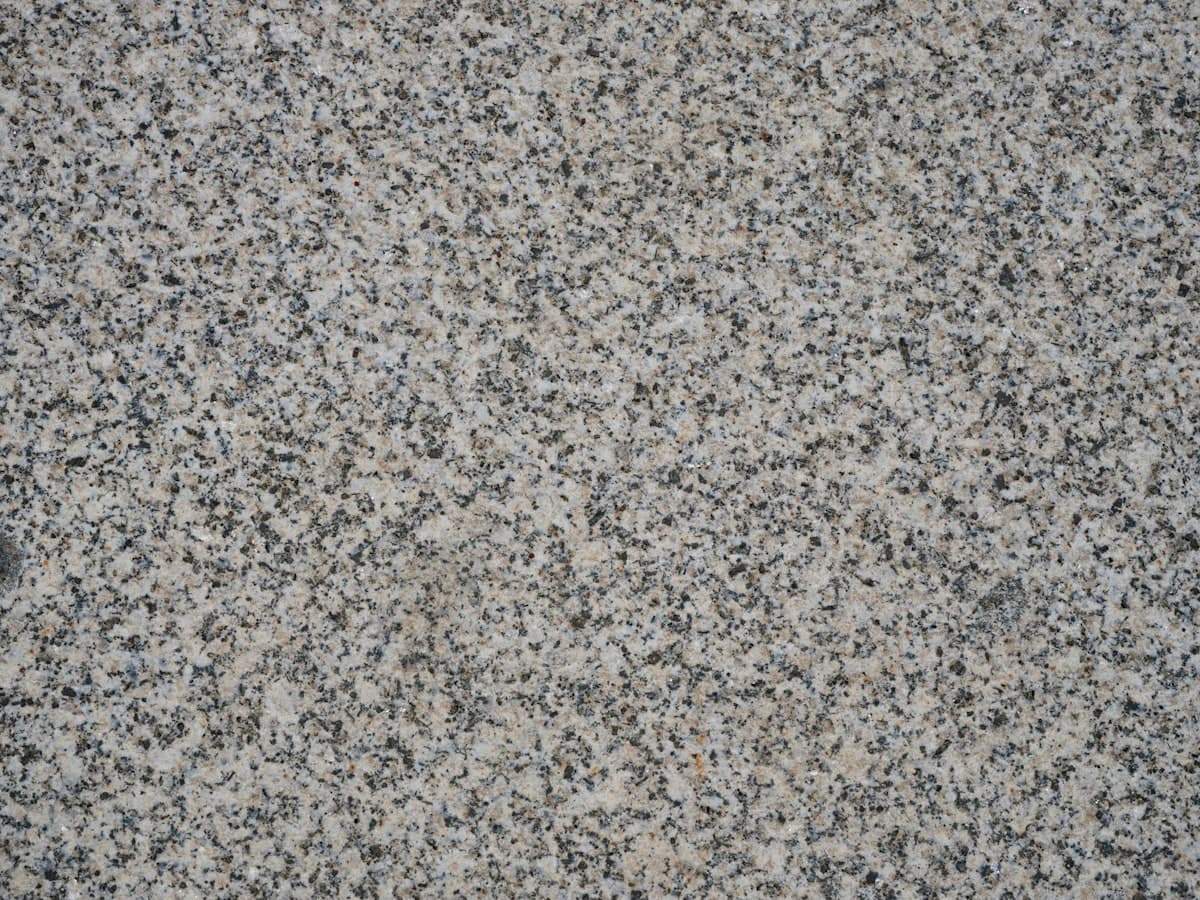 Close-up detail of a ground and sealed concrete surface