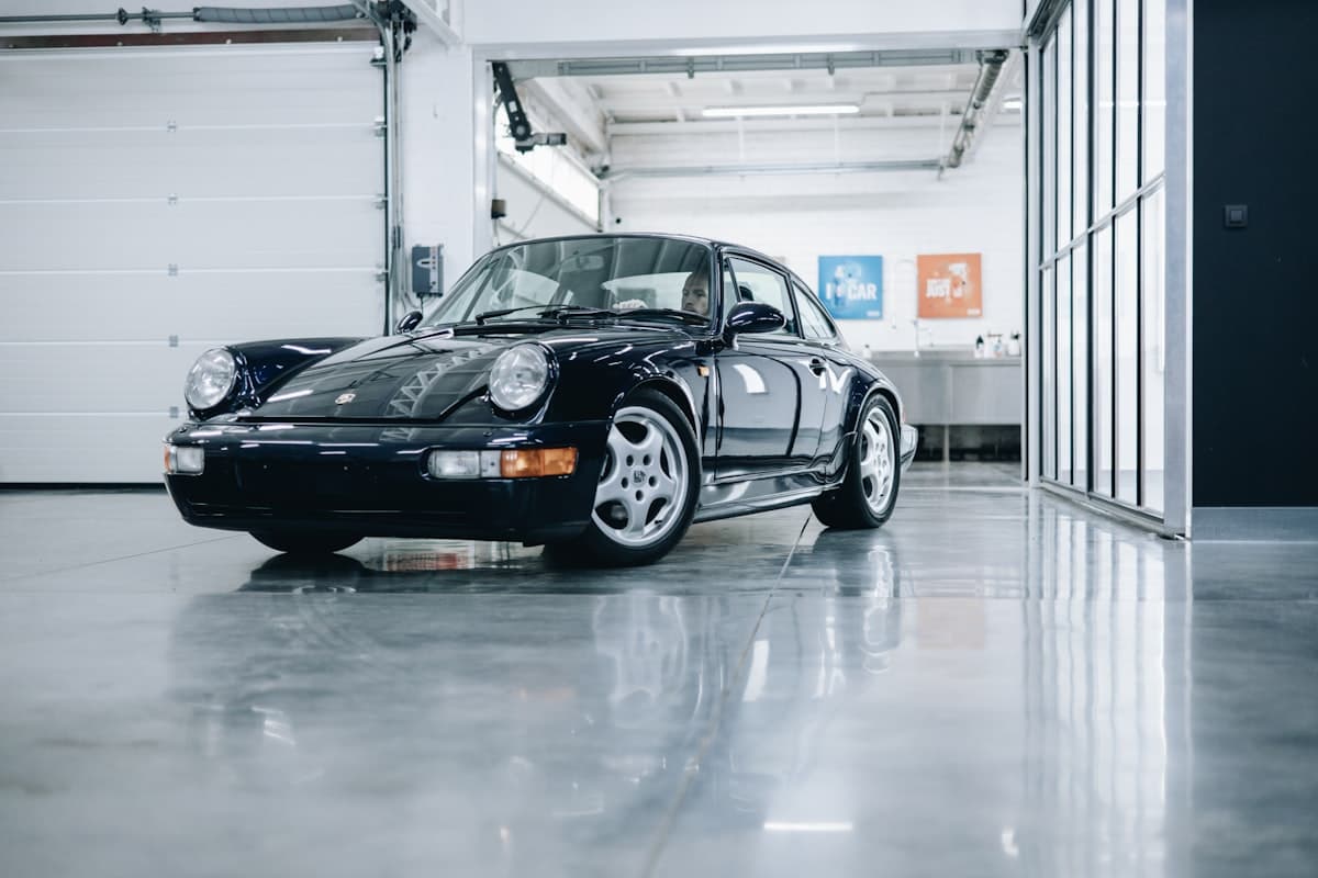 Sports car parked on a mirror-gloss epoxy coated garage floor