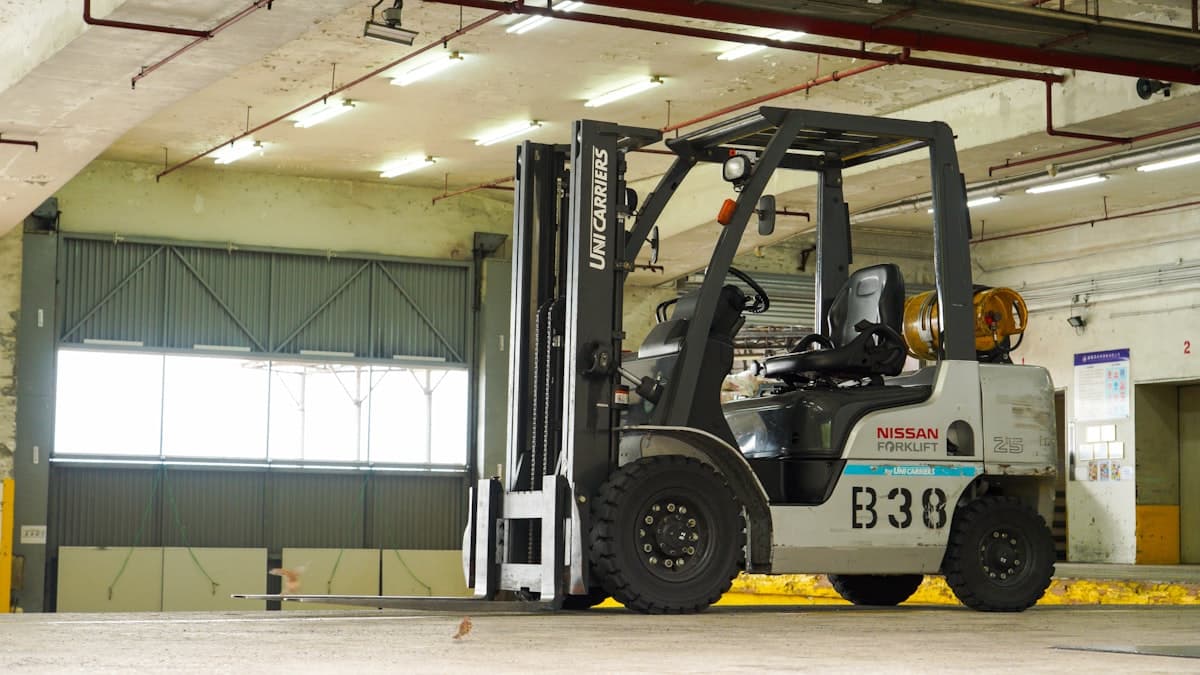 Forklift operating on a coated industrial warehouse floor