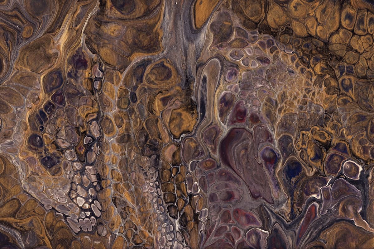 Close-up of a brass-toned metallic epoxy floor finish